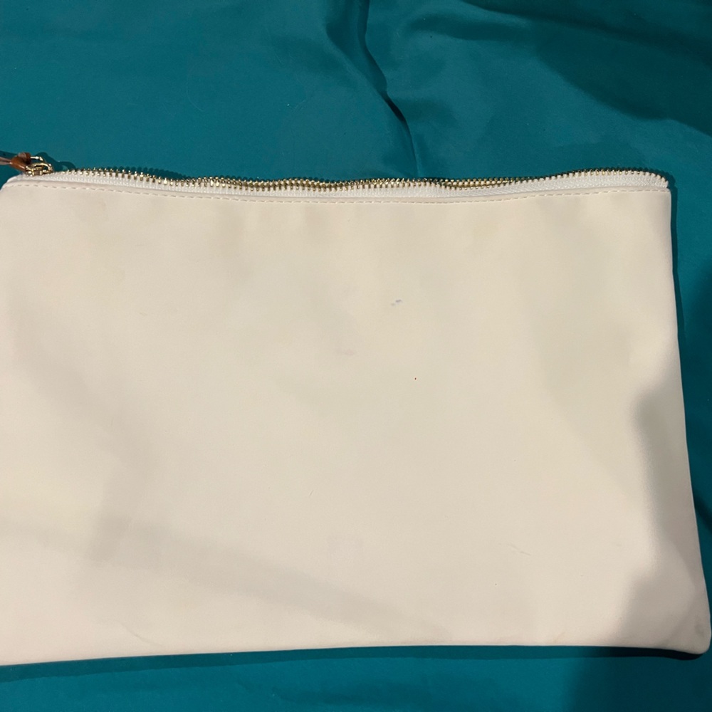 Tommy Hilfiger clutch, or make up bag